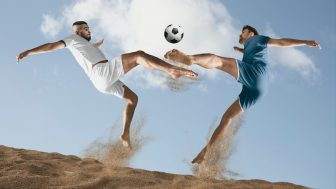 Two,Men,Footballers,Are,Desperately,Playing,Beach,Soccer,On,Sand