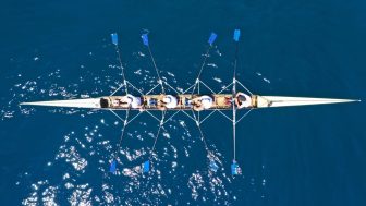 Rowers with paddles out of sync